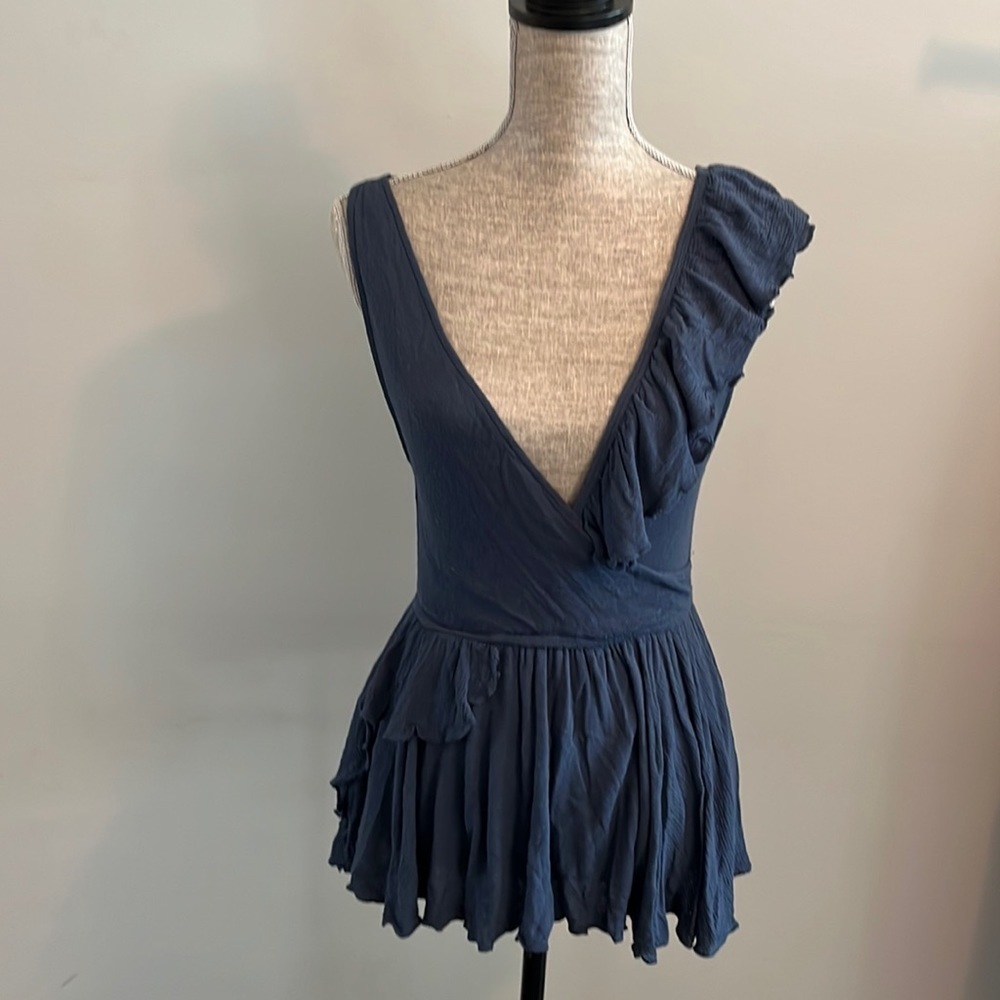 Free People size small sleeveless ruffled tank.